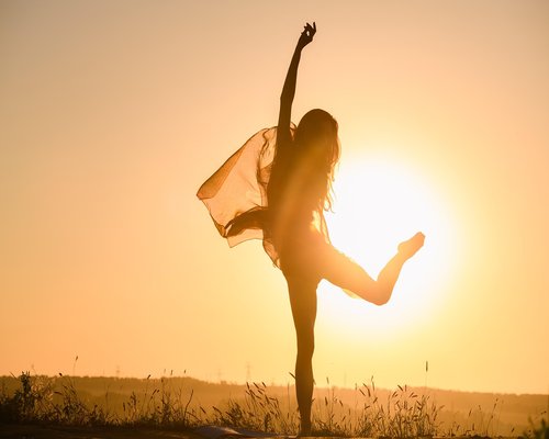 Woman doing yoga outdoors in nature